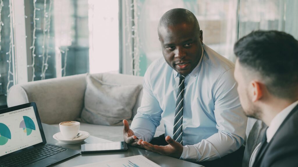 A confident professional presenting ideas during a client meeting