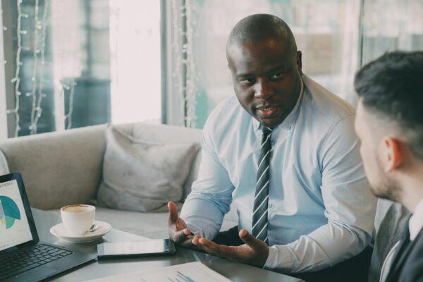 A confident professional presenting ideas during a client meeting